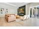 Chic living room with a modern fireplace, comfortable seating, and access to outdoor living spaces at 4210 Waterfront Pkwy, Orlando, FL 32806