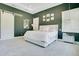 Beautiful main bedroom featuring a plush white bed, stylish gray walls, and elegant lighting fixtures at 4210 Waterfront Pkwy, Orlando, FL 32806