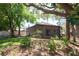 Spacious backyard featuring a screened-in back porch and mature trees at 4336 Cloverleaf Pl, Casselberry, FL 32707