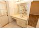Neutral bathroom featuring a single sink vanity, medicine cabinet mirror, and a shower-tub combo at 4336 Cloverleaf Pl, Casselberry, FL 32707