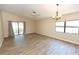 Bright, open-concept living and dining area with tile floors and ceiling fan at 4336 Cloverleaf Pl, Casselberry, FL 32707