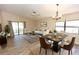 Open-concept living and dining area filled with natural light and neutral paint throughout at 4336 Cloverleaf Pl, Casselberry, FL 32707