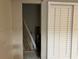 Bright bedroom featuring closet with shutter style doors and tile floors at 4838 Pebble Beach Dr # A, Orlando, FL 32811