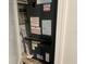 Close-up of HVAC system, showcasing detailed components and maintenance stickers at 4838 Pebble Beach Dr # A, Orlando, FL 32811