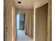 Hallway under construction featuring drywall, open doorways, and potential for customization at 4838 Pebble Beach Dr # A, Orlando, FL 32811