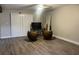 Open living room with modern ceiling fan and durable vinyl flooring at 4838 Pebble Beach Dr # A, Orlando, FL 32811