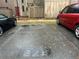 Designated parking spot in a community lot with two vehicles parked on either side at 4838 Pebble Beach Dr # A, Orlando, FL 32811