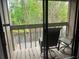 Balcony with two chairs overlooking the peaceful surrounding nature and river, perfect for relaxing outdoors at 4838 Pebble Beach Dr # A, Orlando, FL 32811