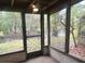 Enclosed porch offers scenic view of greenery and waterway at 4838 Pebble Beach Dr # A, Orlando, FL 32811