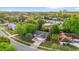 An aerial shot showcasing the home's location in a lush, green neighborhood with mature trees and well-kept yards at 4918 Gifford Blvd, Orlando, FL 32821