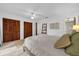 Bright bedroom with wood floors, ceiling fan, and dual closets at 4918 Gifford Blvd, Orlando, FL 32821