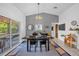 A dining area featuring modern décor and a sliding glass door leading to the outside, ideal for entertaining at 4918 Gifford Blvd, Orlando, FL 32821