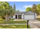 Charming home with a well-manicured lawn, fresh landscaping, and a two car garage at 4918 Gifford Blvd, Orlando, FL 32821