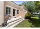 Charming backyard with stairs, stone pavers, and small chairs at 5038 Fenwood Ln, Orlando, FL 32814