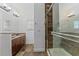 Tiled bathroom with a glass enclosed shower, stylish fixtures, and vanity with double sinks at 5038 Fenwood Ln, Orlando, FL 32814