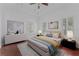 Serene bedroom featuring stylish décor, hardwood floors, and shuttered windows at 5038 Fenwood Ln, Orlando, FL 32814