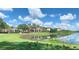 Picturesque community featuring a pond, dock, and walking trail at 5038 Fenwood Ln, Orlando, FL 32814