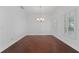 Bright dining room with hardwood floors, plantation shutters, and chandelier at 5038 Fenwood Ln, Orlando, FL 32814