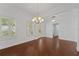 Open dining space featuring hardwood flooring, neutral paint, and lots of natural light at 5038 Fenwood Ln, Orlando, FL 32814