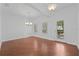 Well-lit dining room with hardwood floors, neutral paint, and access to the outdoors at 5038 Fenwood Ln, Orlando, FL 32814