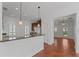 Modern kitchen with granite countertops, stainless appliances, and dark wood cabinetry at 5038 Fenwood Ln, Orlando, FL 32814