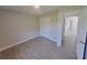 Neutral bedroom featuring ceramic tile flooring and a closet at 506 Peace Way, Kissimmee, FL 34759