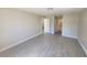 Spacious bedroom with wood-look tile flooring and neutral paint at 506 Peace Way, Kissimmee, FL 34759