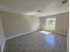 Bright bedroom featuring wood-look tile flooring and a window providing natural light at 506 Peace Way, Kissimmee, FL 34759