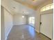 Bright foyer featuring neutral walls, ceramic wood-look flooring, a decorative light fixture, and a large window at 506 Peace Way, Kissimmee, FL 34759