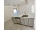 A kitchen island featuring granite countertops, stainless steel sink and dishwasher at 506 Peace Way, Kissimmee, FL 34759