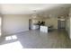 Open-concept living space showcasing the kitchen, dining and living room areas and ample natural light at 506 Peace Way, Kissimmee, FL 34759