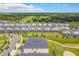 Expansive aerial shot of homes with private pools and views of the adjacent lush golf course and trees at 507 Ocean Course Ave # 507, Davenport, FL 33896