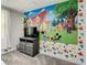 bedroom featuring cartoon wall art, gray dresser and plush carpeting at 507 Ocean Course Ave # 507, Davenport, FL 33896