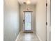 Entryway features neutral walls with decorative accents, white trim, ceramic tile flooring and recessed lighting at 507 Ocean Course Ave # 507, Davenport, FL 33896