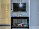 Finished garage featuring a TV and ping pong table supplies and epoxy flooring at 507 Ocean Course Ave # 507, Davenport, FL 33896
