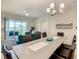 Bright open floor plan with large windows leading to patio from the dining and living room area at 507 Ocean Course Ave # 507, Davenport, FL 33896