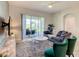 Comfortable living room with plush rug, TV, and access to outdoor patio at 507 Ocean Course Ave # 507, Davenport, FL 33896