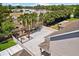 An aerial view showcases the home's expansive backyard with custom paver patio, pergola, and lush landscaping at 528 Seven Oaks Blvd, Winter Springs, FL 32708