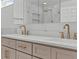 Bathroom features a double vanity, modern sinks, gold fixtures, and stylish cabinets, perfect for everyday routines at 528 Seven Oaks Blvd, Winter Springs, FL 32708