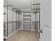 Spacious walk-in closet features wire shelving and ample storage, offering organization and convenience at 528 Seven Oaks Blvd, Winter Springs, FL 32708