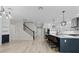 Open-concept kitchen featuring a large island with bar seating and stainless steel appliances at 528 Seven Oaks Blvd, Winter Springs, FL 32708