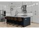Stunning kitchen island with sleek appliances, pendant lights, and stylish bar stools at 528 Seven Oaks Blvd, Winter Springs, FL 32708