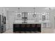 Stylish kitchen with stainless steel appliances, shaker cabinets and a large island at 528 Seven Oaks Blvd, Winter Springs, FL 32708