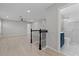Open-concept living area with hardwood floors and a view of the updated bathroom at 528 Seven Oaks Blvd, Winter Springs, FL 32708