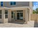 A covered patio showcases a brick paver floor, and a sliding door offers access to the house at 528 Seven Oaks Blvd, Winter Springs, FL 32708