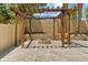 Paver patio showcasing a custom wooden pergola with a swing seat and built in fire pit at 528 Seven Oaks Blvd, Winter Springs, FL 32708