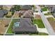 Aerial view of a home featuring a screened-in pool in a residential neighborhood at 6758 Hillis Dr, Lakeland, FL 33813