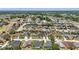 Wide aerial view showcasing a residential neighborhood with tree-lined streets at 6758 Hillis Dr, Lakeland, FL 33813