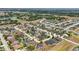 High aerial view of homes in a community, some with pools and landscaped yards at 6758 Hillis Dr, Lakeland, FL 33813