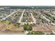 Aerial view of a community with homes featuring pools and manicured landscaping at 6758 Hillis Dr, Lakeland, FL 33813
